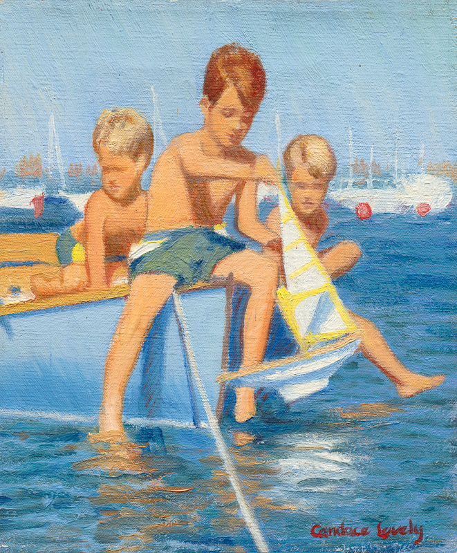 Boys playing with toy boat