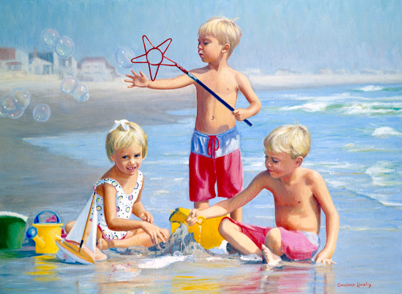 Children playing at the beach with bubbles