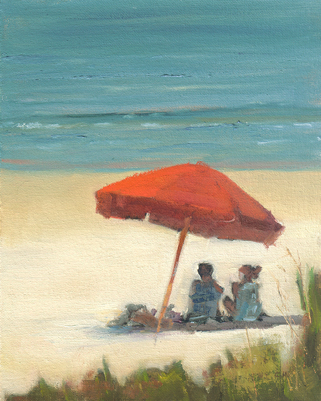 red umbrella on the beach with couple